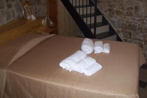 A bed or beds in a room at La Dimora di Angela