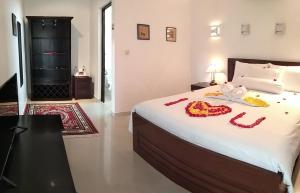 Voodi või voodid majutusasutuse Jos & Hanny Homestay toas