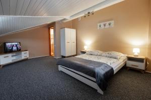 Posteľ alebo postele v izbe v ubytovaní Apartamenty Pod Gondolą
