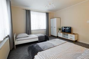 Posteľ alebo postele v izbe v ubytovaní Apartamenty Pod Gondolą