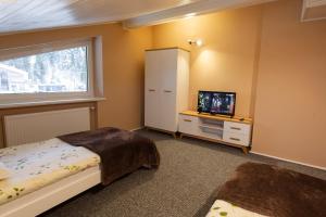 Posteľ alebo postele v izbe v ubytovaní Apartamenty Pod Gondolą