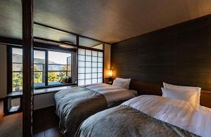 Postel nebo postele na pokoji v ubytování Hakone Kyuan