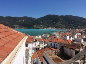 a view of a city and a body of water at Angies House in Skopelos Town