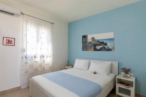 A bed or beds in a room at House Myrtos