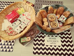 two baskets filled with different types of bread and snacks at Rosita Rooms in Lecce