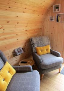 a room with two chairs and a couch and a table at Harlosh Hideaways - Stargazer Pod in Harlosh