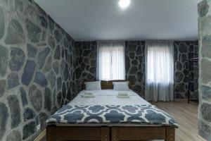 Postel nebo postele na pokoji v ubytování Hotel Complex Nabadi