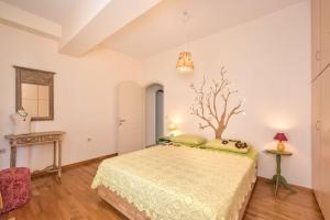 A bed or beds in a room at Irida's House, a fairylike house with supurb view