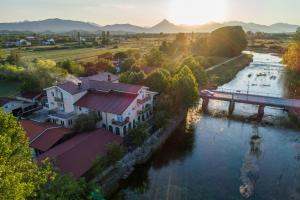 an aerial view of a house next to a river at Motel Most in Ljubuški