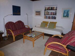 a living room with a couch and a coffee table at Casa Naranjo in Puntagorda