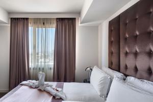 Rúm í herbergi á Lady Stern Jerusalem Hotel