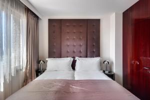 Rúm í herbergi á Lady Stern Jerusalem Hotel