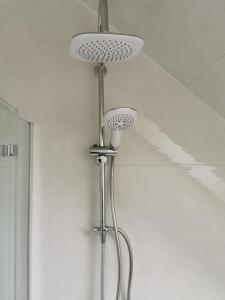 a ceiling light with a fan on a wall at Apartments Margaretenhof in Wilhelmshaven +24 photos