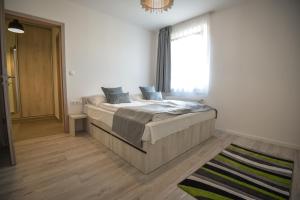 Postel nebo postele na pokoji v ubytování Francesca Apartman