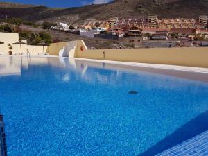 Bazén v ubytování Villa Roque del Conde with fantastic sea view, terrace, pool, Wifi, SAT-TV, garage nebo v jeho okolí