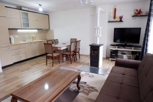 Kuchyň nebo kuchyňský kout v ubytování Hotel Kings Apartments
