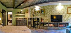 a living room with a flat screen tv on the wall at U Paluku in Chrudim