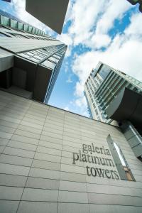 a building with a sign on the side of it at Platinum Towers E-Apartments in Warsaw