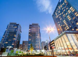 a group of tall buildings in a city at night at Platinum Towers Central Apartments in Warsaw