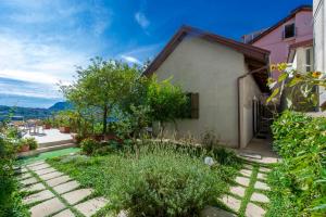 a house with a garden in front of it at La Casetta in Agerola