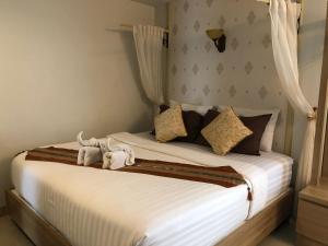 Ein Bett oder Betten in einem Zimmer der Unterkunft Namamema