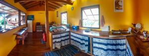 a kitchen with a large island in a room at Painapaopao Backpacker in Moorea