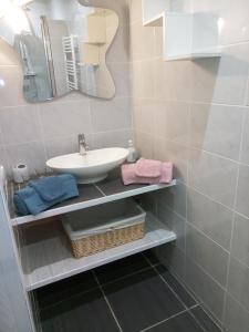 a bathroom with a sink and a mirror at La chambre du Clos Barriant in Séreilhac