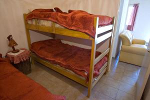 a couple of bunk beds in a room at Cabañas Orión in Potrerillos