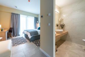 Postel nebo postele na pokoji v ubytování Hotel Seventh