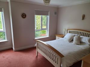 A bed or beds in a room at Wolseley Park guest house