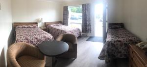 Postel nebo postele na pokoji v ubytování Century Motel + 37 fotografií