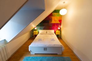 Postel nebo postele na pokoji v ubytování APPARTEMENT LE VITAMINE - topbnb dijon + 7 fotografií