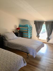 Una cama o camas en una habitación de Villa Milka