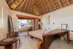Postel nebo postele na pokoji v ubytování Hotel Ma'xanab Tulum