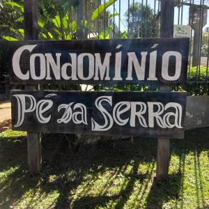 a sign for apc sanremo psa serrano at Chalé Pé da Serra in Penedo