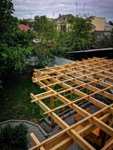 a bunch of wooden framing for a house at Southside Bed and Breakfast in Bishkek