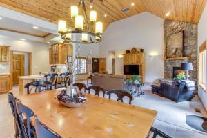 a dining room and living room with a table and chairs at Catkin Lane 04 | Discover Sunriver in Sunriver