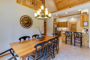 a kitchen and dining room with a wooden table and chairs at Catkin Lane 04 | Discover Sunriver in Sunriver