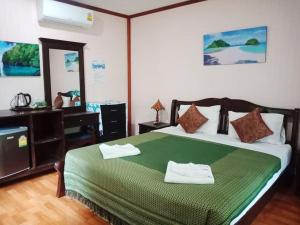 Postel nebo postele na pokoji v ubytování Anawin Bungalows