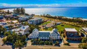 an aerial view of a resort next to the ocean at Byron Bay Beachfront Apartments in Byron Bay