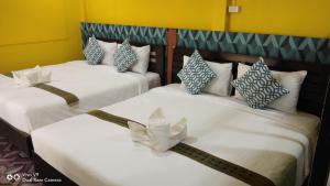 Ein Bett oder Betten in einem Zimmer der Unterkunft Baan Asree บ้านอัสรี
