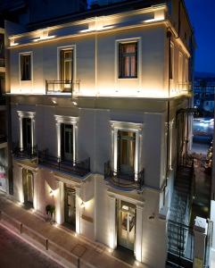 a large white building with lights on it at Marpessa Hotel & Spa in Agrinion