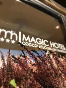 a sign for a magic house with flowers at Magic Hotel in Atena Lucana
