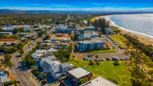 a large body of water with houses and trees at Byron Bay Beachfront Apartments in Byron Bay