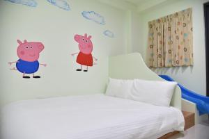 Letto o letti in una camera di Kids Heart Home