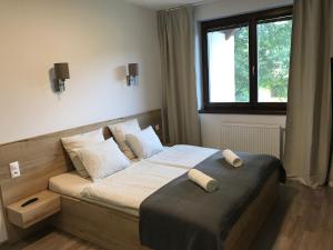 Postel nebo postele na pokoji v ubytování Apartmán Lomnička - Tatranská Lomnica - Krásny výhľad na Vysoké Tatry
