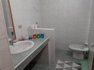 a bathroom with a sink and a toilet at B&B Milano in Milan