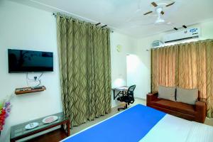 Ένα ή περισσότερα κρεβάτια σε δωμάτιο στο STAAYZ Premium Gurgaon