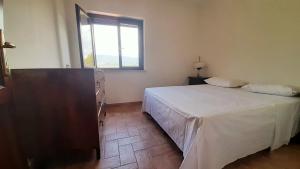 a bedroom with a large bed and a window at Villa Pacchini Wellness & Relax Retreat in Poggio Mirteto +41 photos