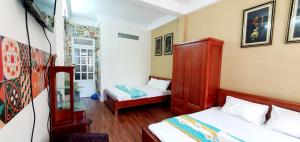 Tempat tidur dalam kamar di Forget Me Not Hotel